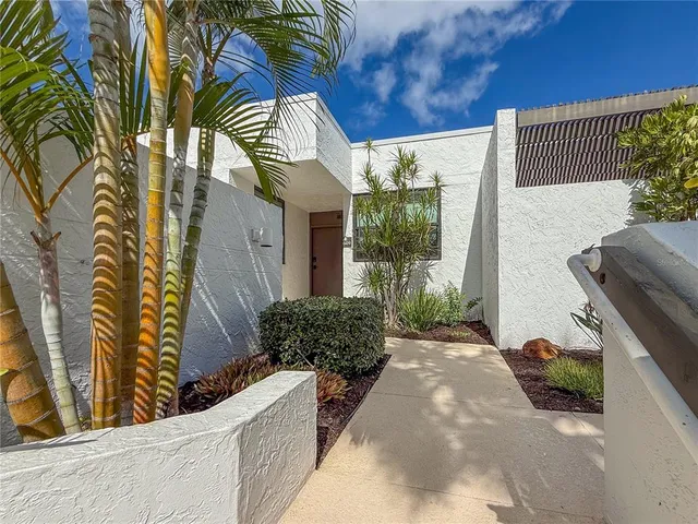a potted plant in front of a house