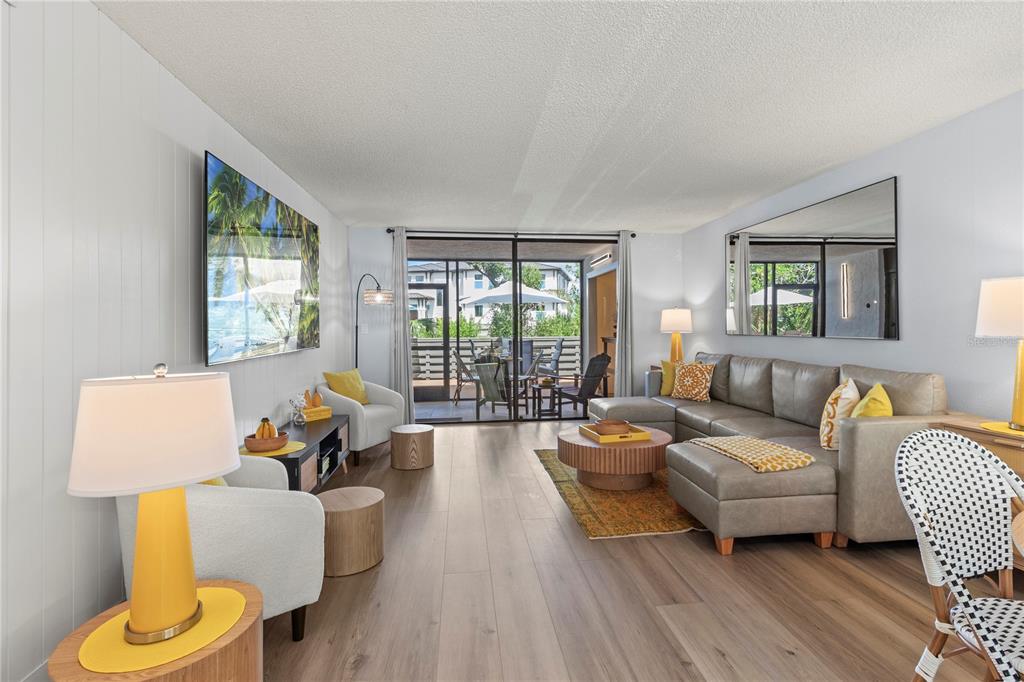 609 Bayport Way, Unit 609 Longboat Key, FL 34228 - Photo 21 of 77 a living room with furniture and a large window