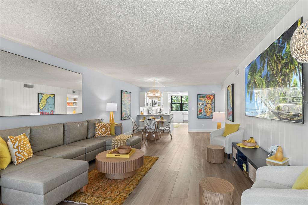 609 Bayport Way, Unit 609 Longboat Key, FL 34228 - Photo 24 of 77 a living room with furniture and a large window