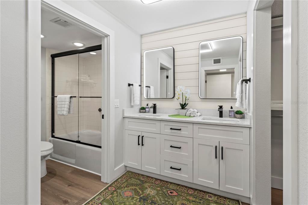 609 Bayport Way, Unit 609 Longboat Key, FL 34228 - Photo 30 of 77 a bathroom with a double vanity sink mirror and