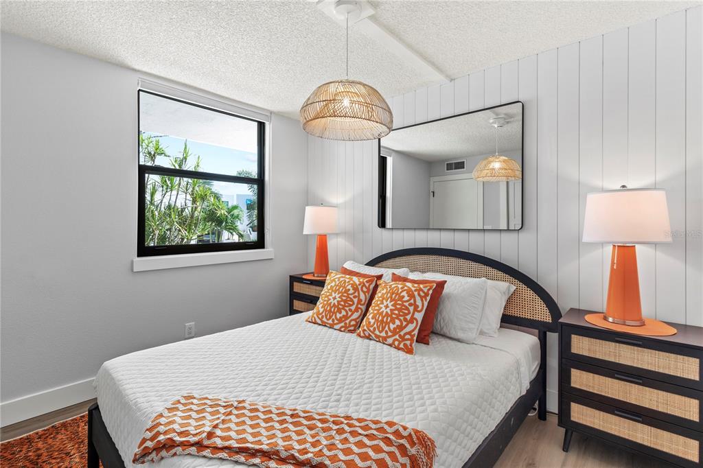 609 Bayport Way, Unit 609 Longboat Key, FL 34228 - Photo 35 of 77 a bedroom with a bed and a window