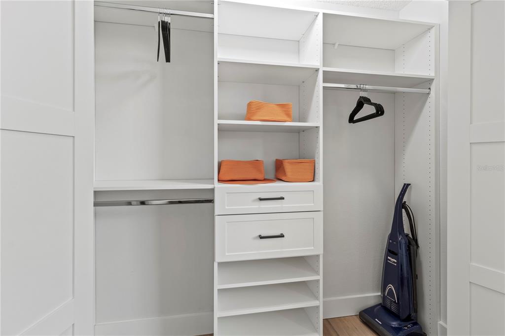 609 Bayport Way, Unit 609 Longboat Key, FL 34228 - Photo 37 of 77 a view of walk in closet with clothes and shoes