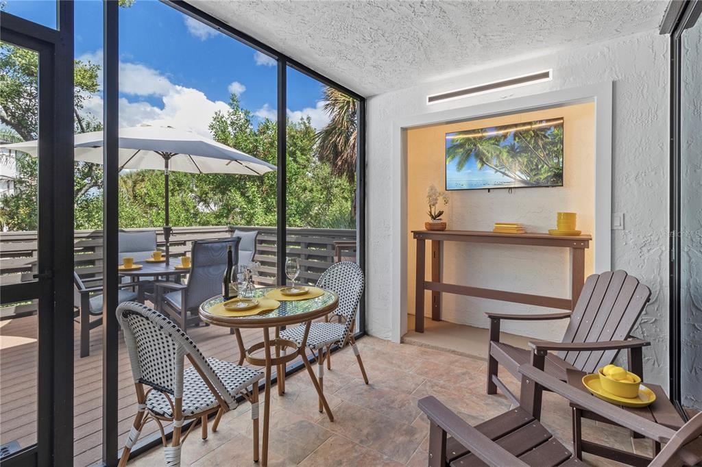 609 Bayport Way, Unit 609 Longboat Key, FL 34228 - Photo 40 of 77 a view of a dining room with furniture window and outside view