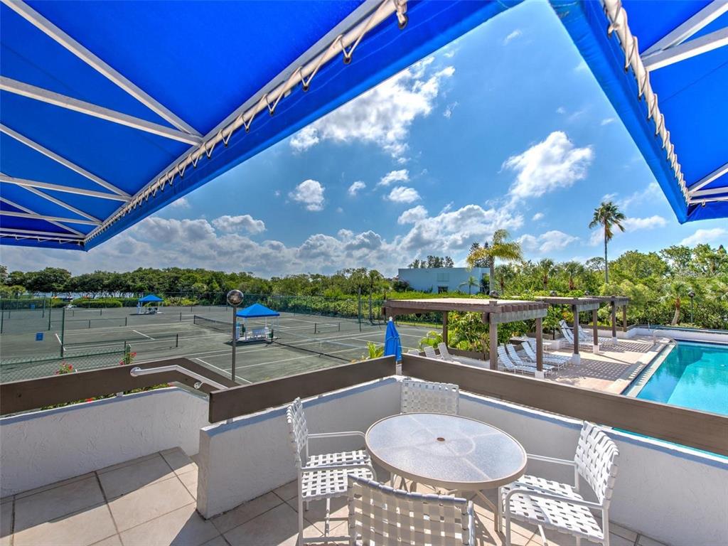 609 Bayport Way, Unit 609 Longboat Key, FL 34228 - Photo 56 of 77 a view of a balcony with mountain view and wooden floor