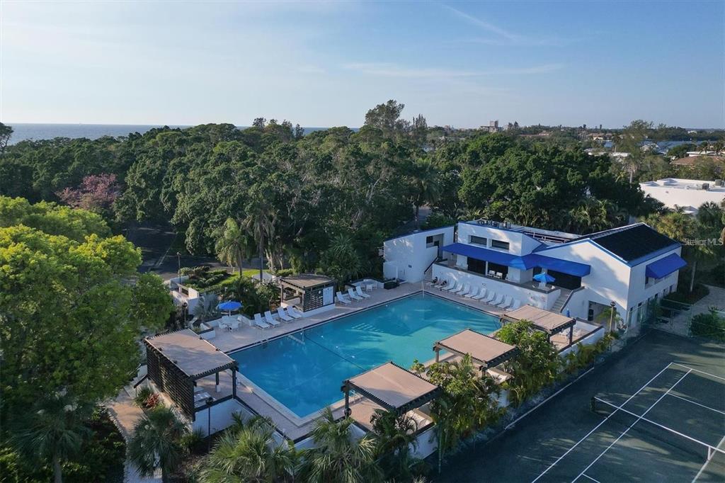 609 Bayport Way, Unit 609 Longboat Key, FL 34228 - Photo 58 of 77 an aerial view of a house with swimming pool garden and lake view
