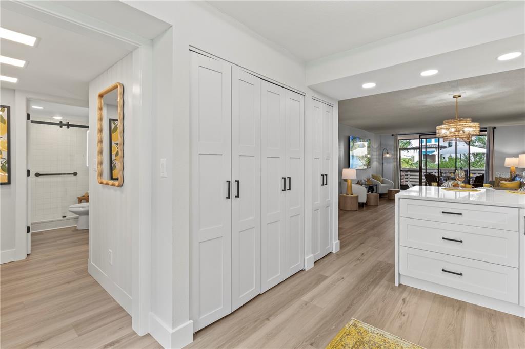 609 Bayport Way, Unit 609 Longboat Key, FL 34228 - Photo 8 of 77 a view of bathroom with a shower and a mirror