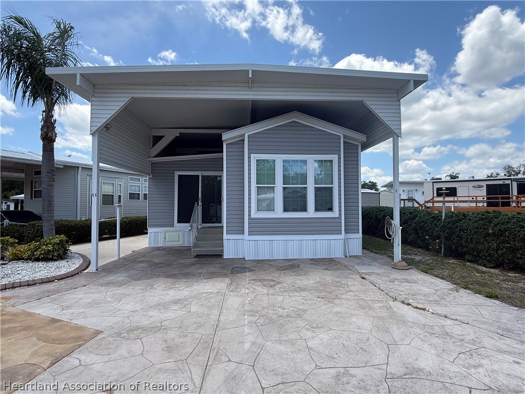 53 Freedom Way Lake Placid, FL 33852 - Photo 1 of 26 a view of a house with a yard