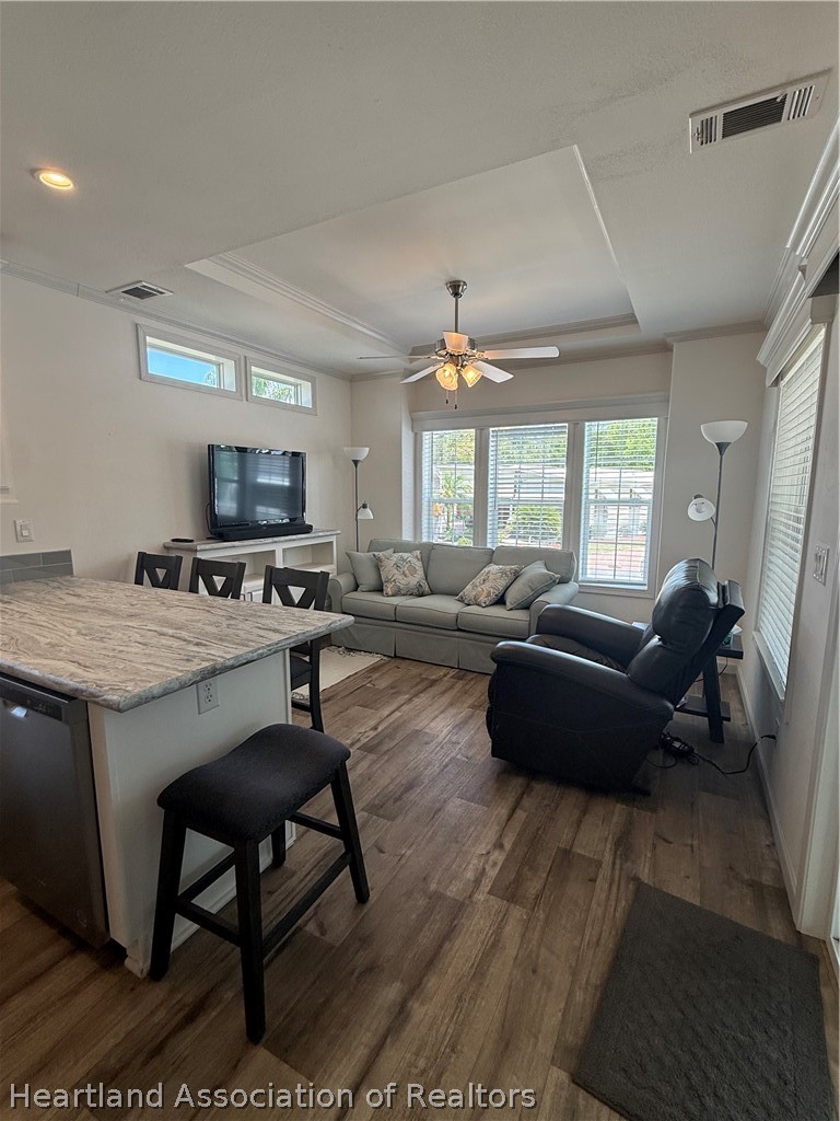 53 Freedom Way Lake Placid, FL 33852 - Photo 12 of 26 a living room with furniture and a flat screen tv