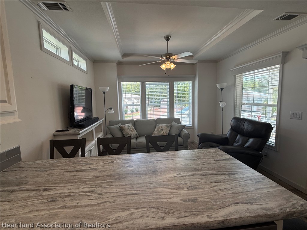 53 Freedom Way Lake Placid, FL 33852 - Photo 13 of 26 a living room with furniture flat screen tv and a fireplace
