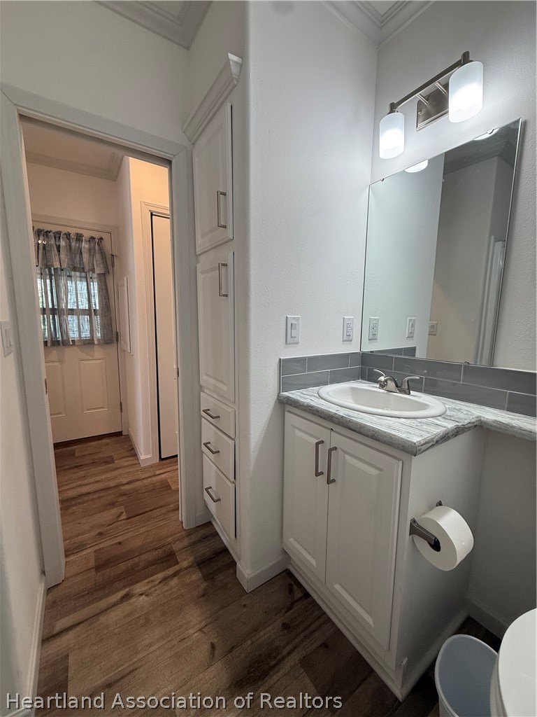53 Freedom Way Lake Placid, FL 33852 - Photo 17 of 26 a bathroom with a sink mirror and toilet