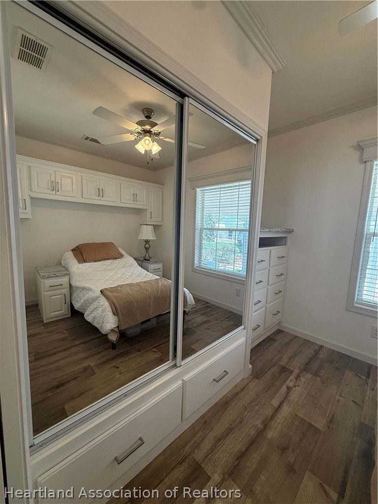 53 Freedom Way Lake Placid, FL 33852 - Photo 19 of 26 a bedroom with a bed and a large window