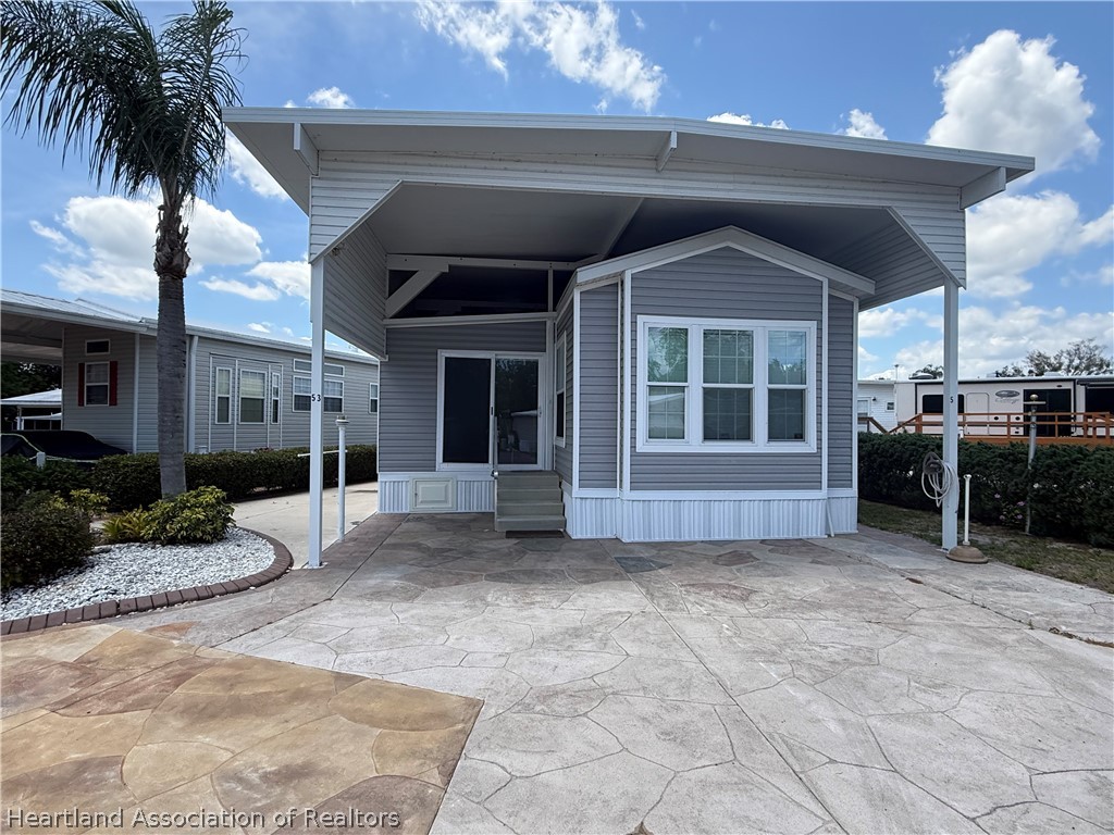 53 Freedom Way Lake Placid, FL 33852 - Photo 2 of 26 a view of a house with a yard