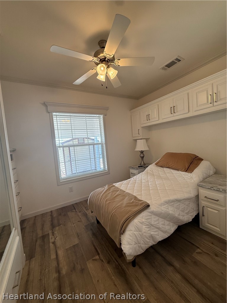 53 Freedom Way Lake Placid, FL 33852 - Photo 21 of 26 a bedroom with a bed and window