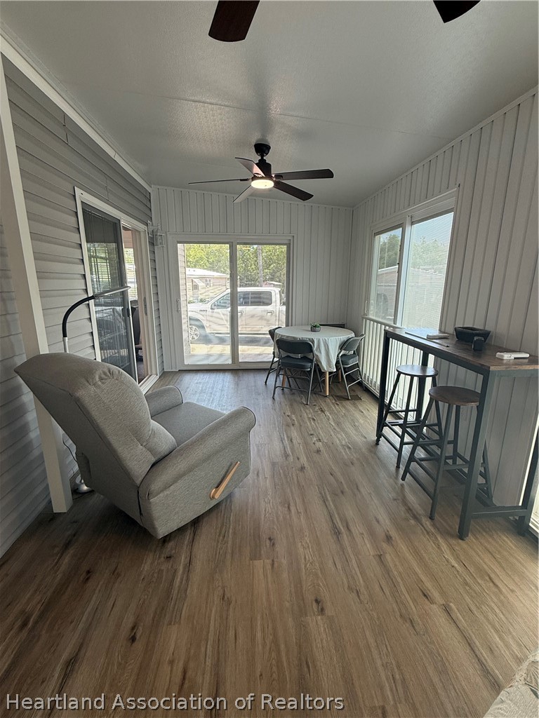 53 Freedom Way Lake Placid, FL 33852 - Photo 22 of 26 a living room with furniture and a wooden floor