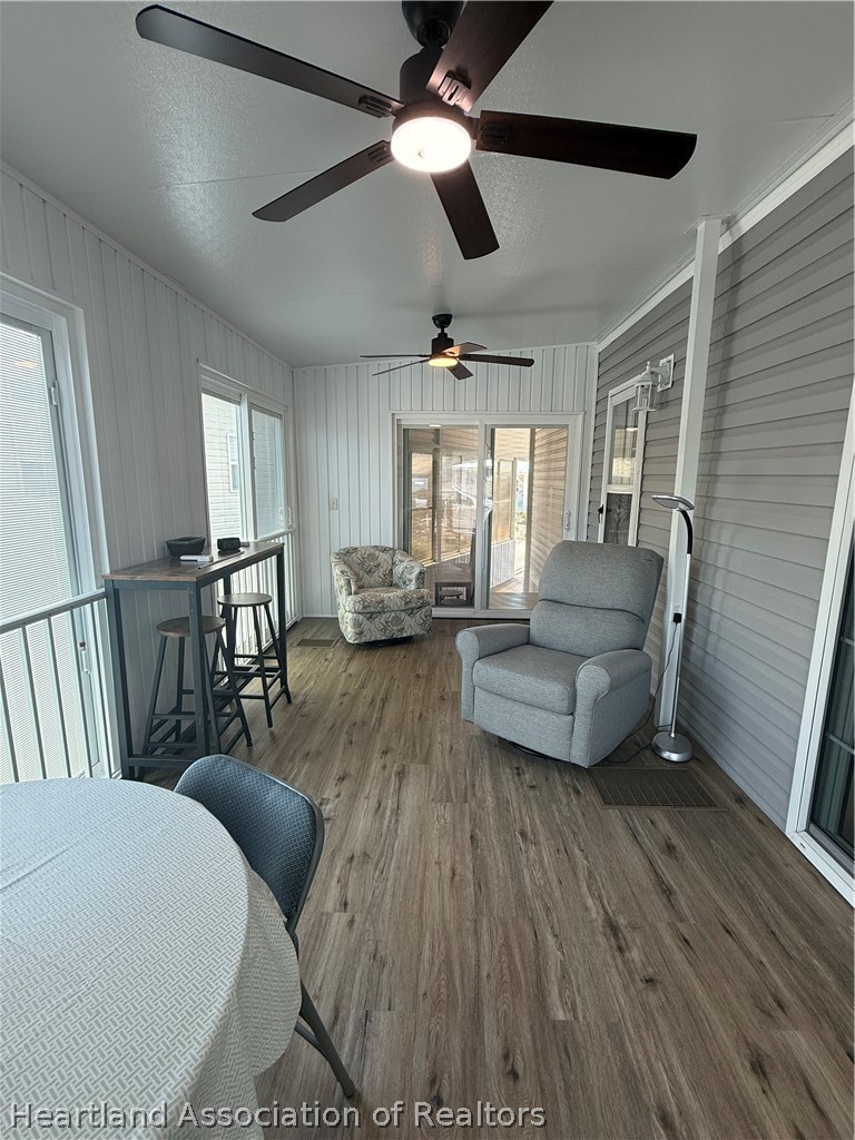 53 Freedom Way Lake Placid, FL 33852 - Photo 23 of 26 a living room with furniture and a wooden floor