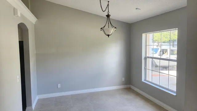 a view of an empty room with a window