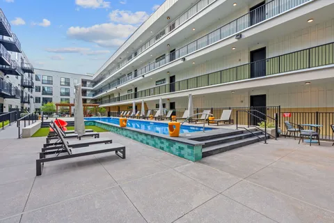 a stairs and bench sitting in front of building