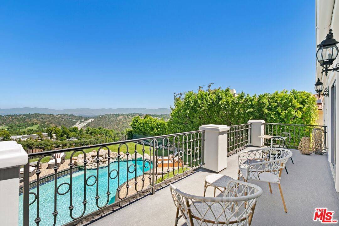 12519 Promontory Road Los Angeles, CA 90049 - Photo 4 of 10 a view of a chairs and table in patio