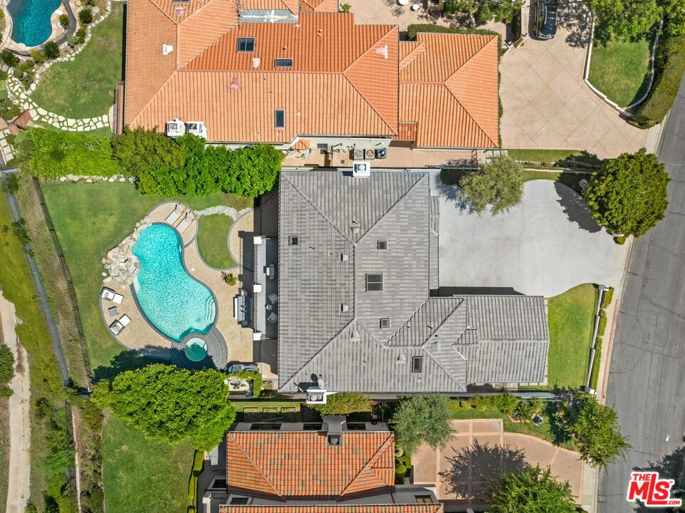 12519 Promontory Road Los Angeles, CA 90049 - Photo 8 of 10 an aerial view of a house with a swimming pool