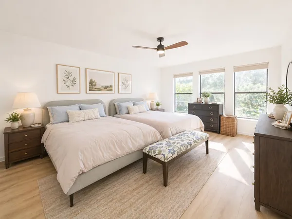 a spacious bedroom with a bed and a couch