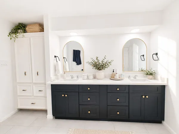 a bathroom with a sink double vanity and a mirror