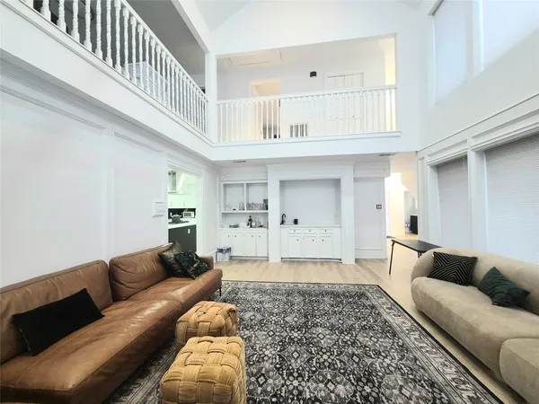 a living room with furniture and a rug