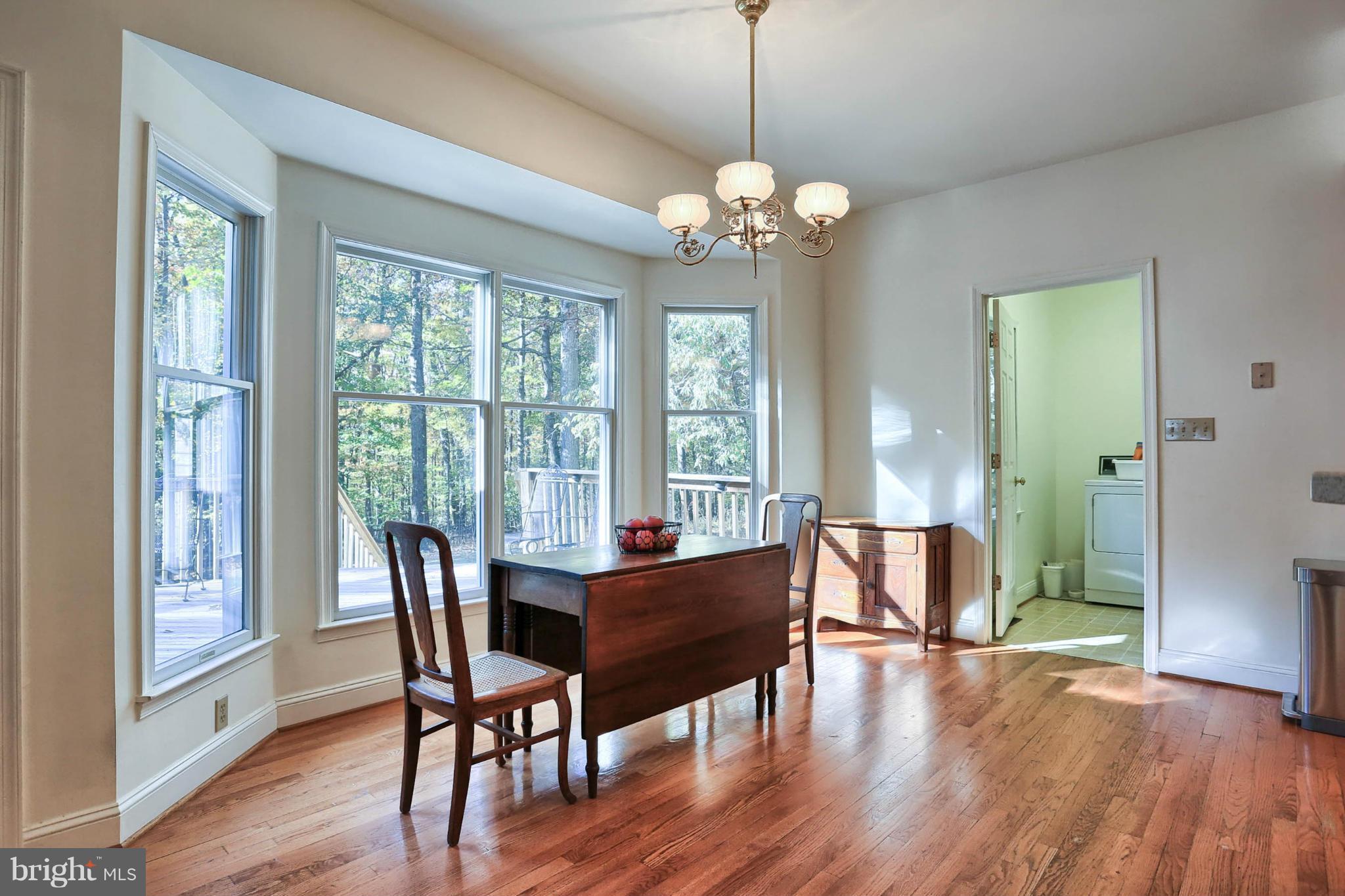 4905 Teen Barnes Road Frederick, MD 21703 - Photo 12 of 30 a view of a dining room with furniture window and wooden floor
