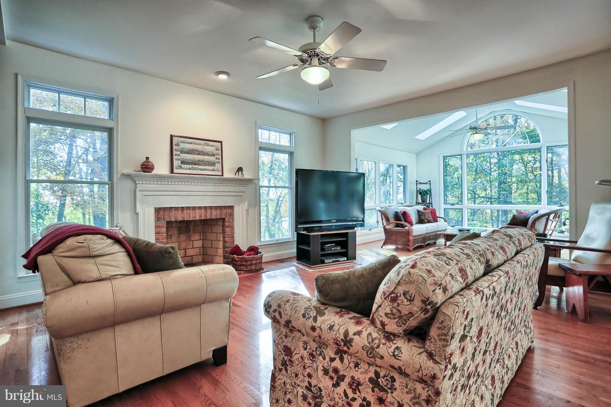 4905 Teen Barnes Road Frederick, MD 21703 - Photo 14 of 30 a living room with furniture a fireplace and a large window