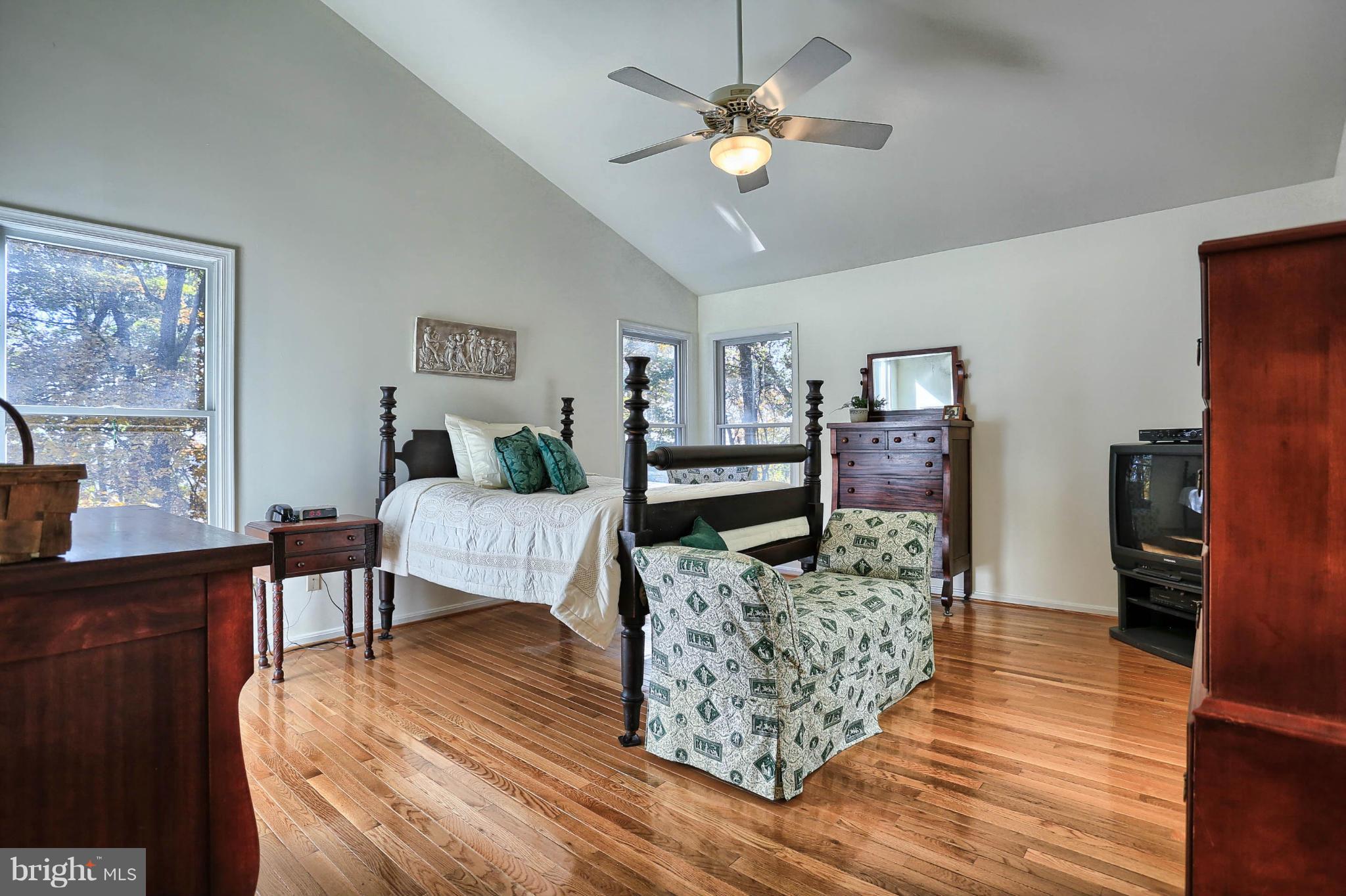 4905 Teen Barnes Road Frederick, MD 21703 - Photo 17 of 30 a living room with fireplace furniture and a wooden floor