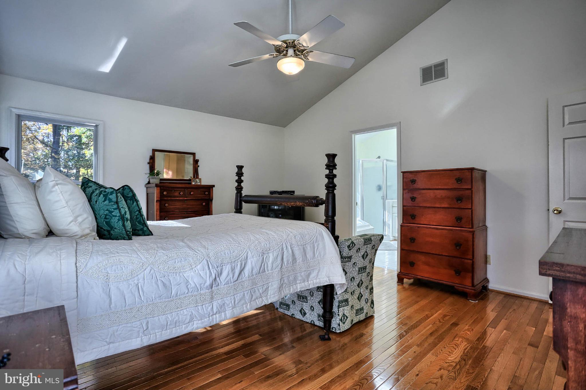 4905 Teen Barnes Road Frederick, MD 21703 - Photo 18 of 30 a bedroom with a bed and wooden floor