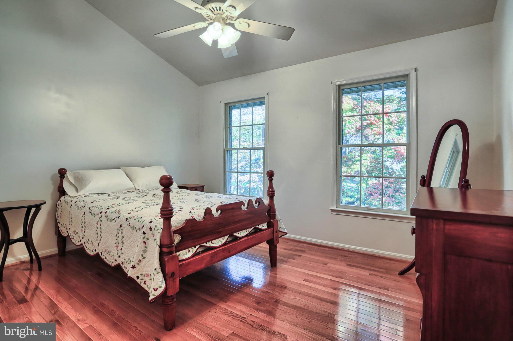4905 Teen Barnes Road Frederick, MD 21703 - Photo 21 of 30 a bed sitting in a bedroom next to a window