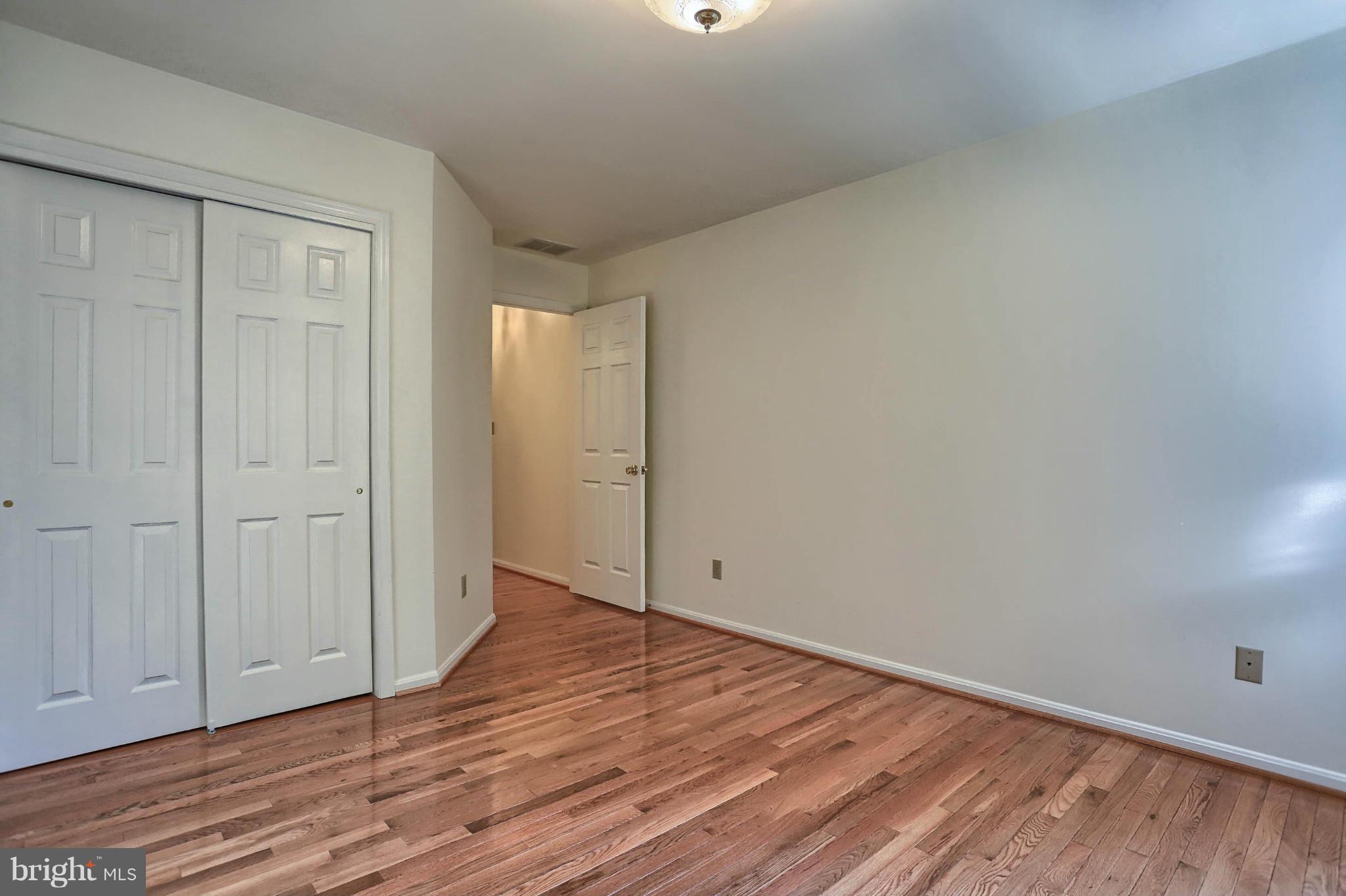 4905 Teen Barnes Road Frederick, MD 21703 - Photo 23 of 30 a view of an empty room and wooden floor