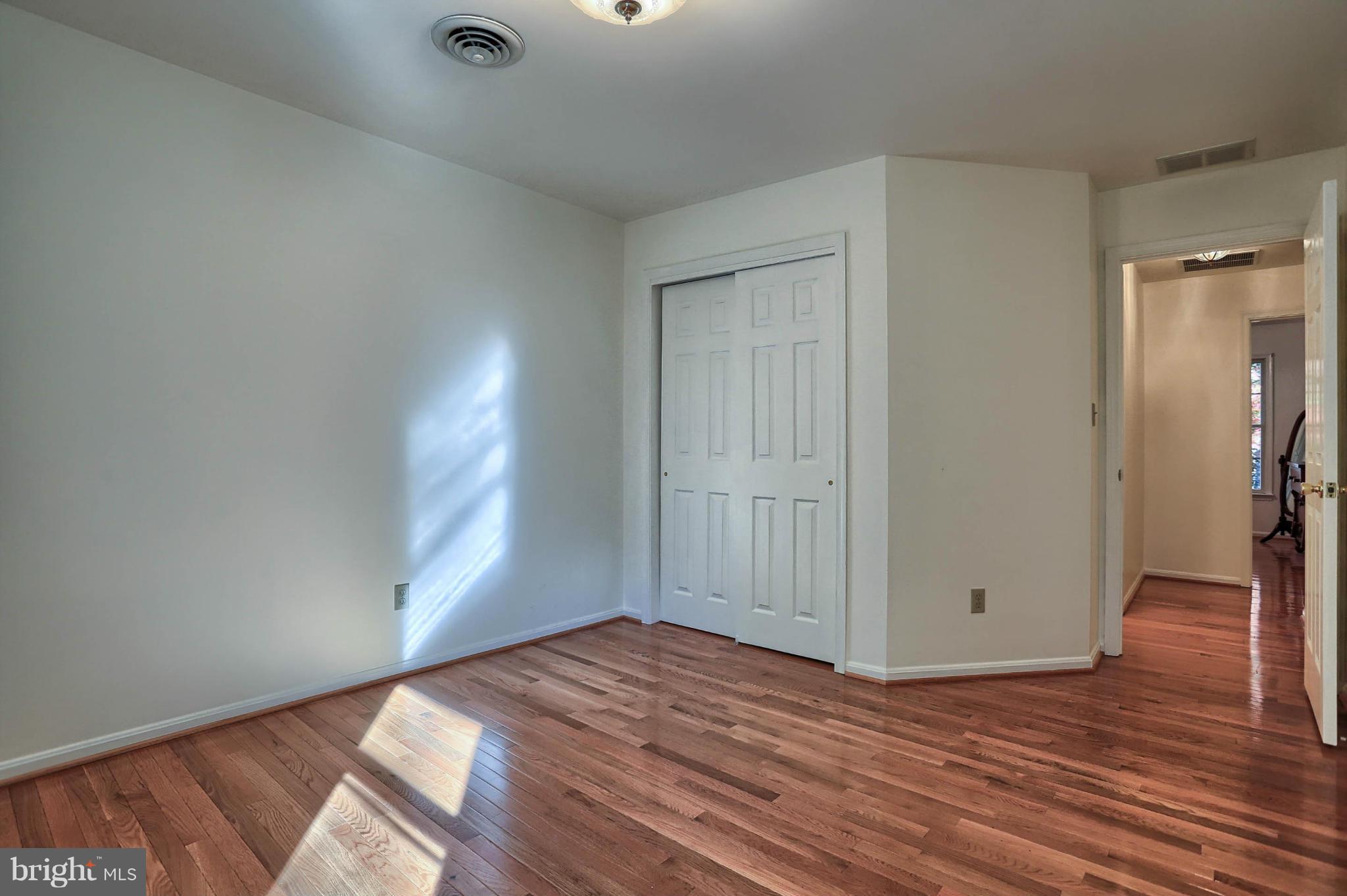 4905 Teen Barnes Road Frederick, MD 21703 - Photo 24 of 30 a view of empty room with wooden floor