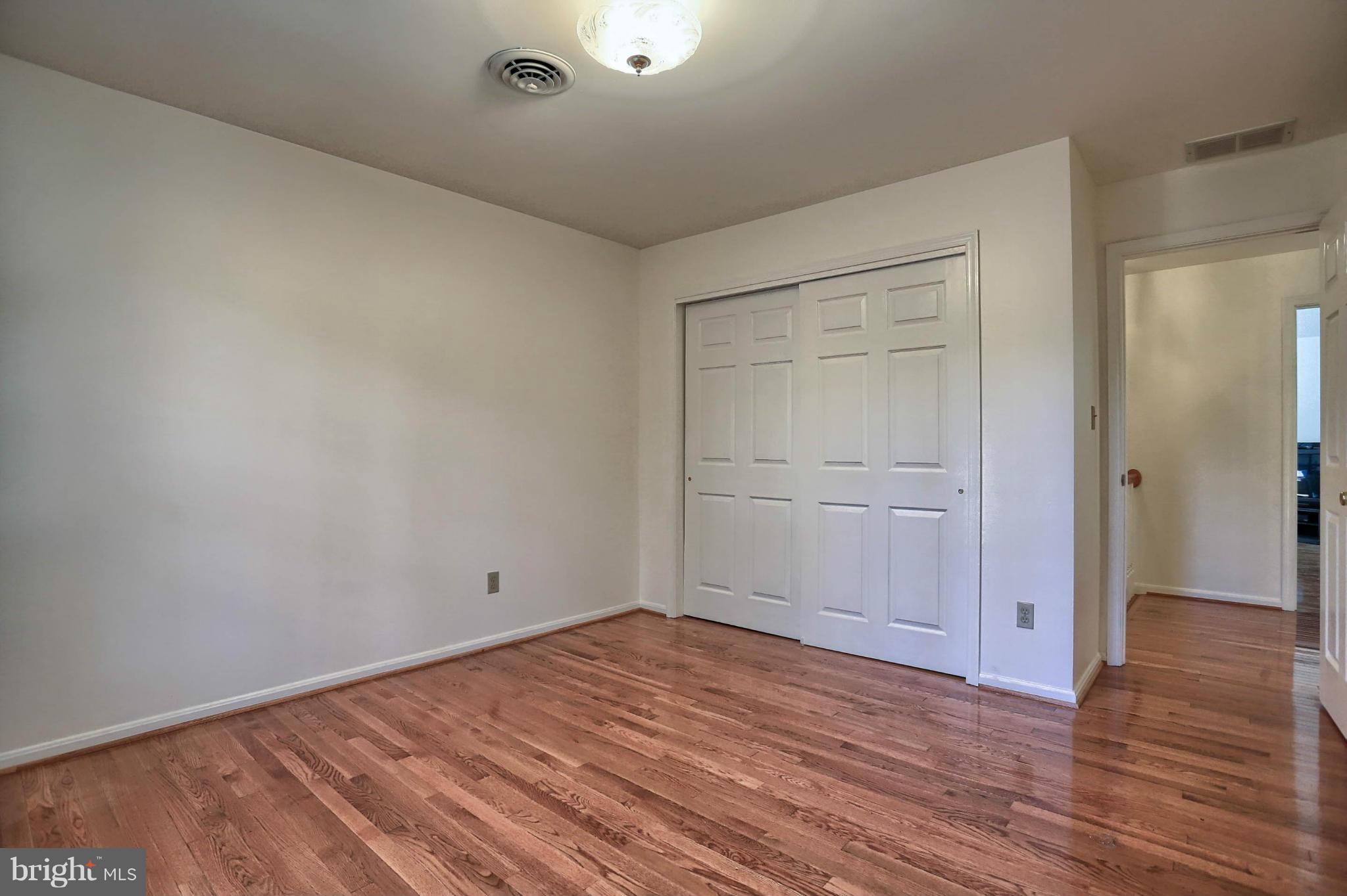 4905 Teen Barnes Road Frederick, MD 21703 - Photo 26 of 30 a view of empty room with wooden floor