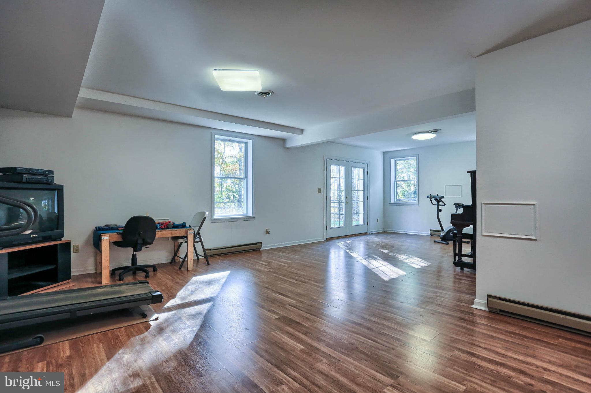 4905 Teen Barnes Road Frederick, MD 21703 - Photo 28 of 30 a living room with furniture and a wooden floor