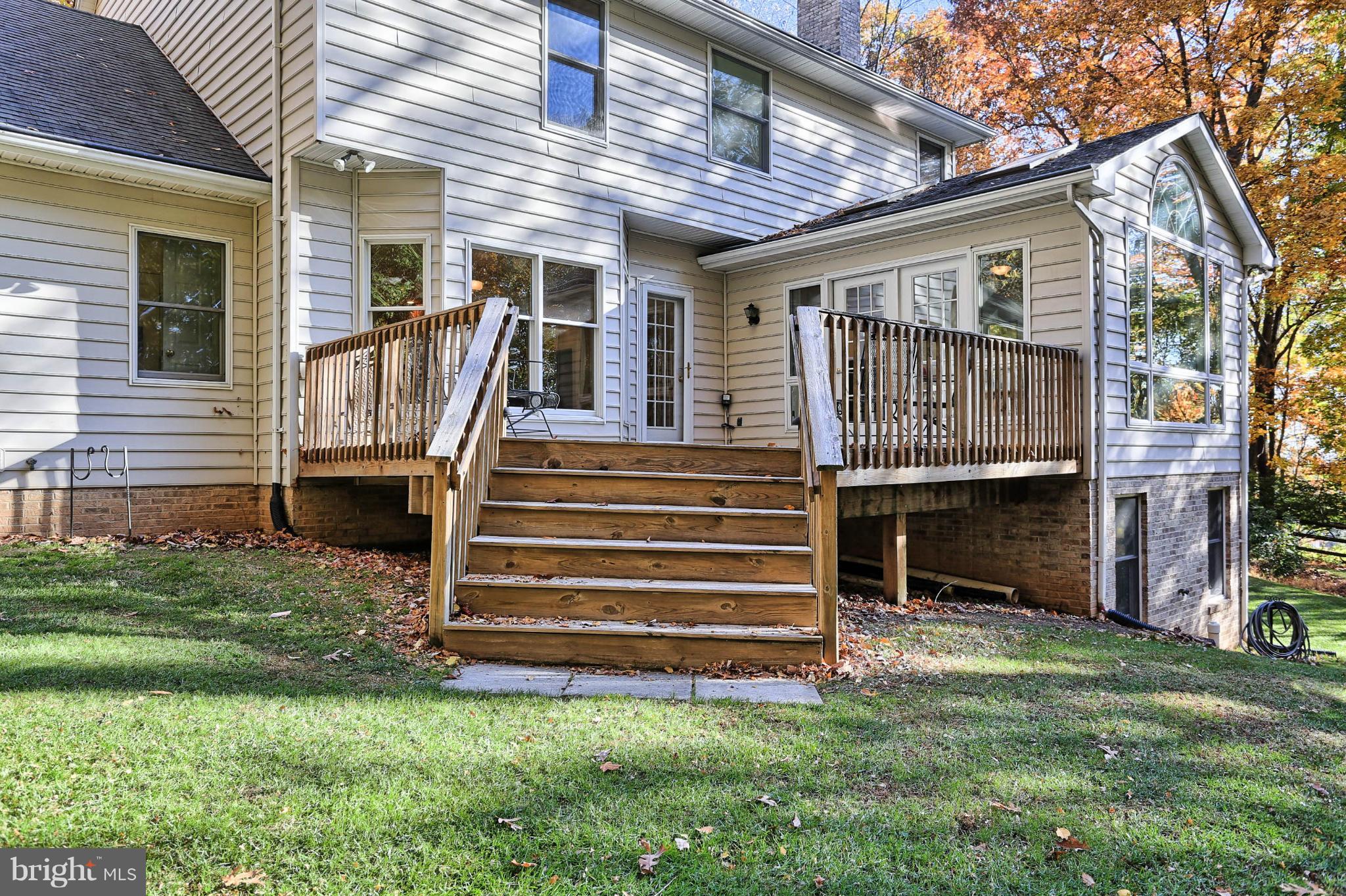 4905 Teen Barnes Road Frederick, MD 21703 - Photo 4 of 30 a view of a house with a small yard and wooden fence