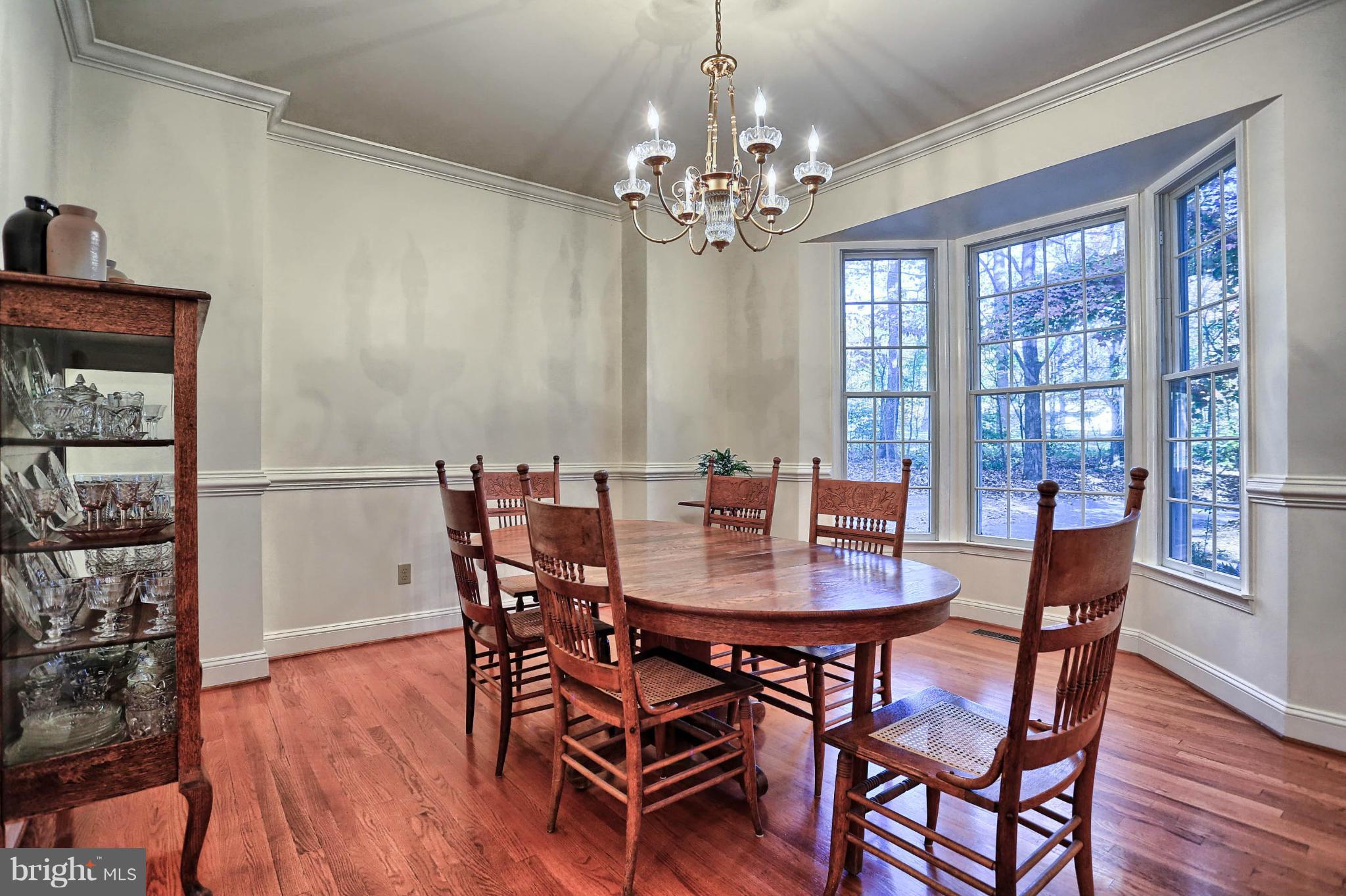 4905 Teen Barnes Road Frederick, MD 21703 - Photo 9 of 30 a view of a dining room with furniture window and wooden floor