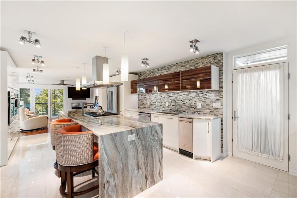 2437 Mt Royal Road Pittsburgh, PA 15217 - Photo 20 of 39 a kitchen with stainless steel appliances granite countertop a stove a sink and a refrigerator