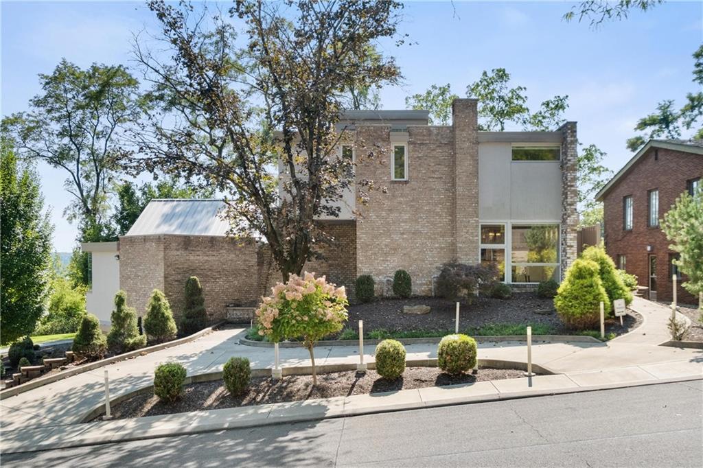 2437 Mt Royal Road Pittsburgh, PA 15217 - Photo 2 of 39 a front view of a house with garden