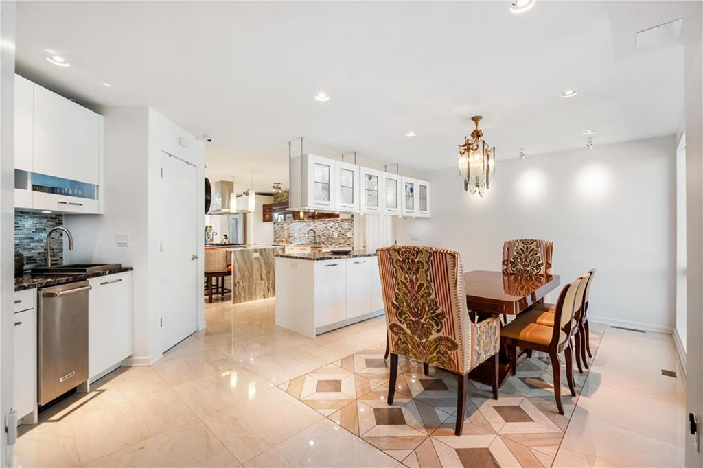 2437 Mt Royal Road Pittsburgh, PA 15217 - Photo 21 of 39 a view of a dining room with furniture and a kitchen