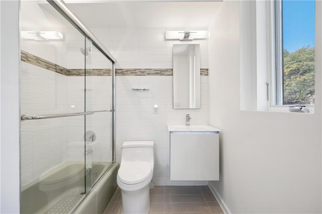 2437 Mt Royal Road Pittsburgh, PA 15217 - Photo 30 of 39 a bathroom with a toilet a sink and shower