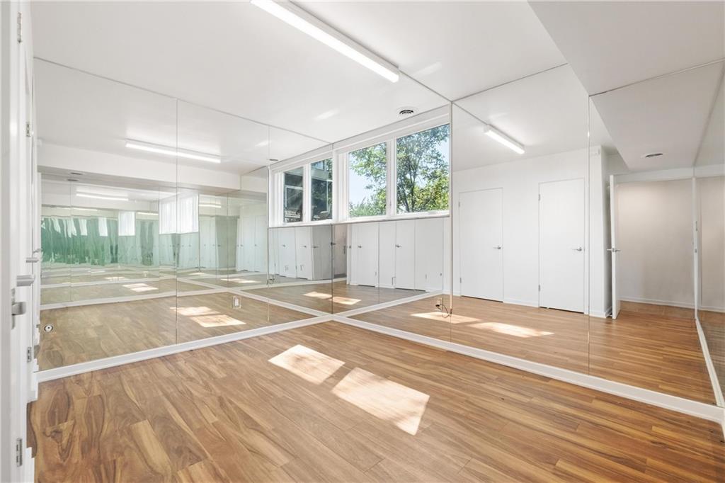 2437 Mt Royal Road Pittsburgh, PA 15217 - Photo 33 of 39 a view of a livingroom with wooden floor and a ceiling fan