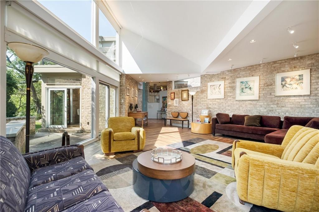 2437 Mt Royal Road Pittsburgh, PA 15217 - Photo 10 of 39 a living room with furniture and a large window