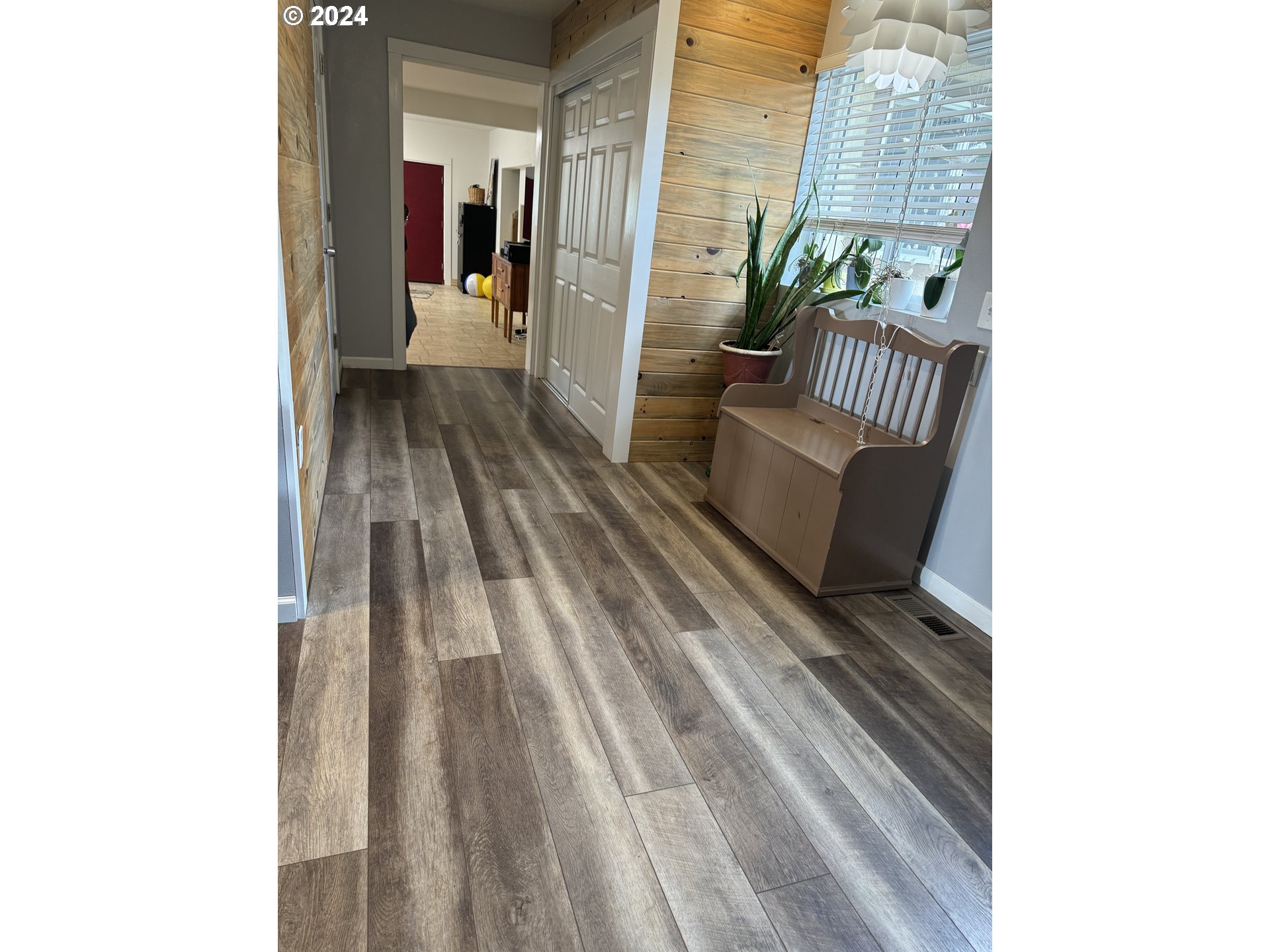 508 3rd Avenue Dallesport, WA 98617 - Photo 11 of 48 a view of a hallway with wooden floor