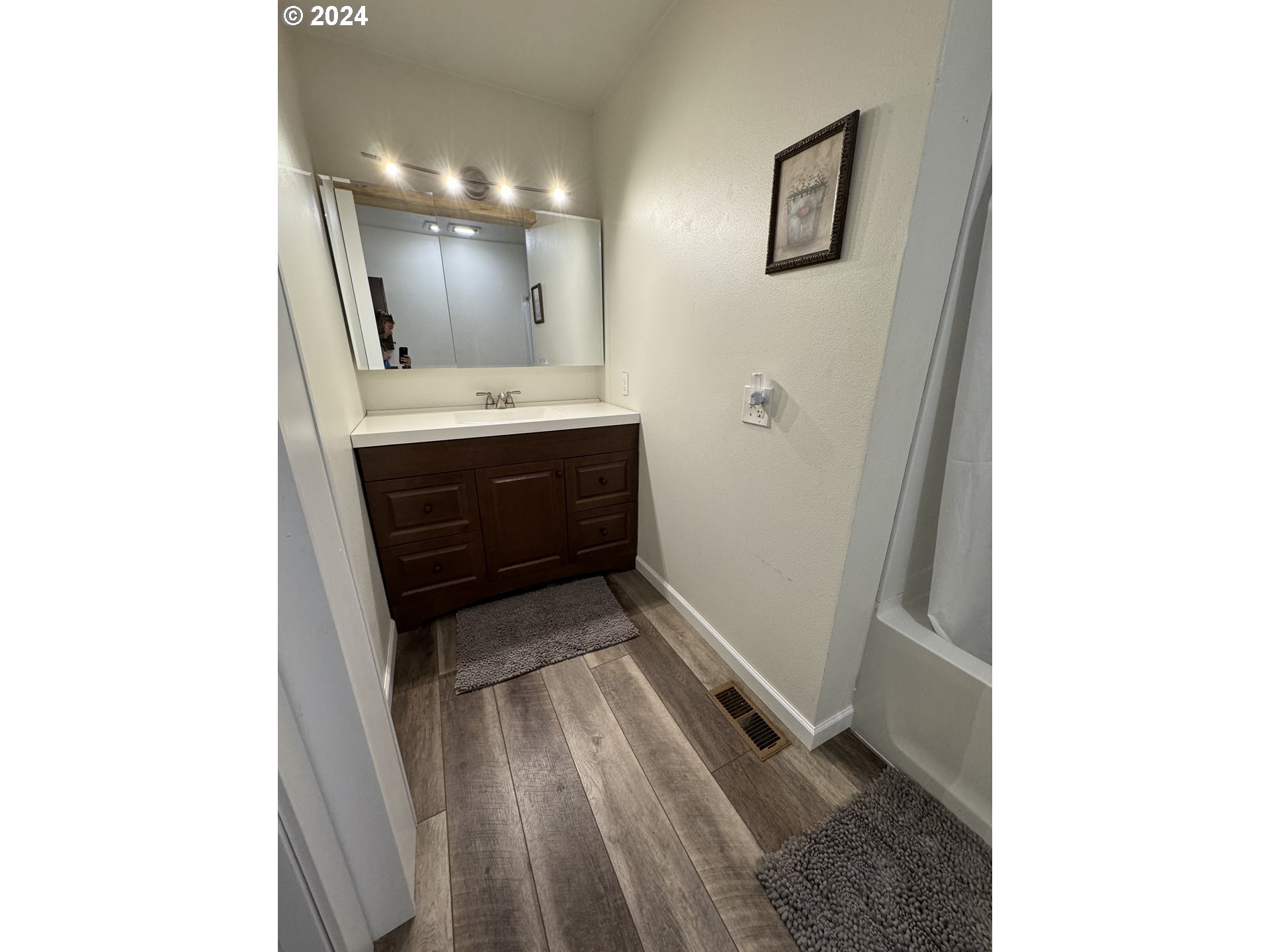 508 3rd Avenue Dallesport, WA 98617 - Photo 13 of 48 a bathroom with a sink a mirror and a toilet