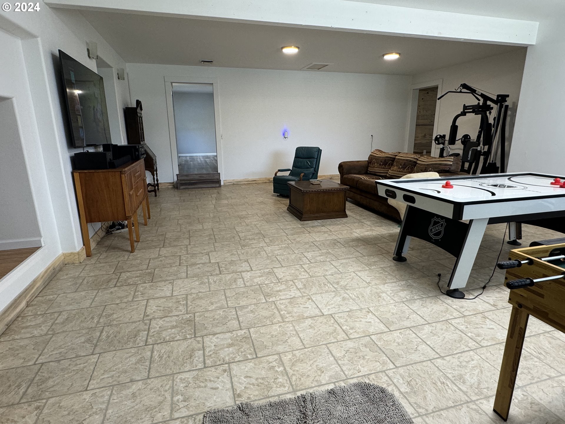 508 3rd Avenue Dallesport, WA 98617 - Photo 15 of 48 a living room with furniture a flat screen tv and a table