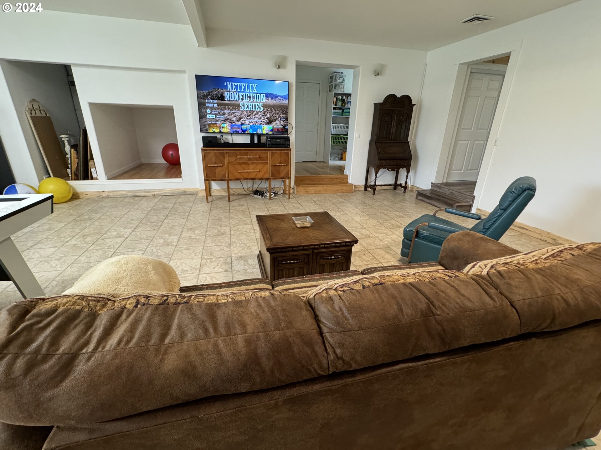508 3rd Avenue Dallesport, WA 98617 - Photo 16 of 48 a living room with furniture and a flat screen tv