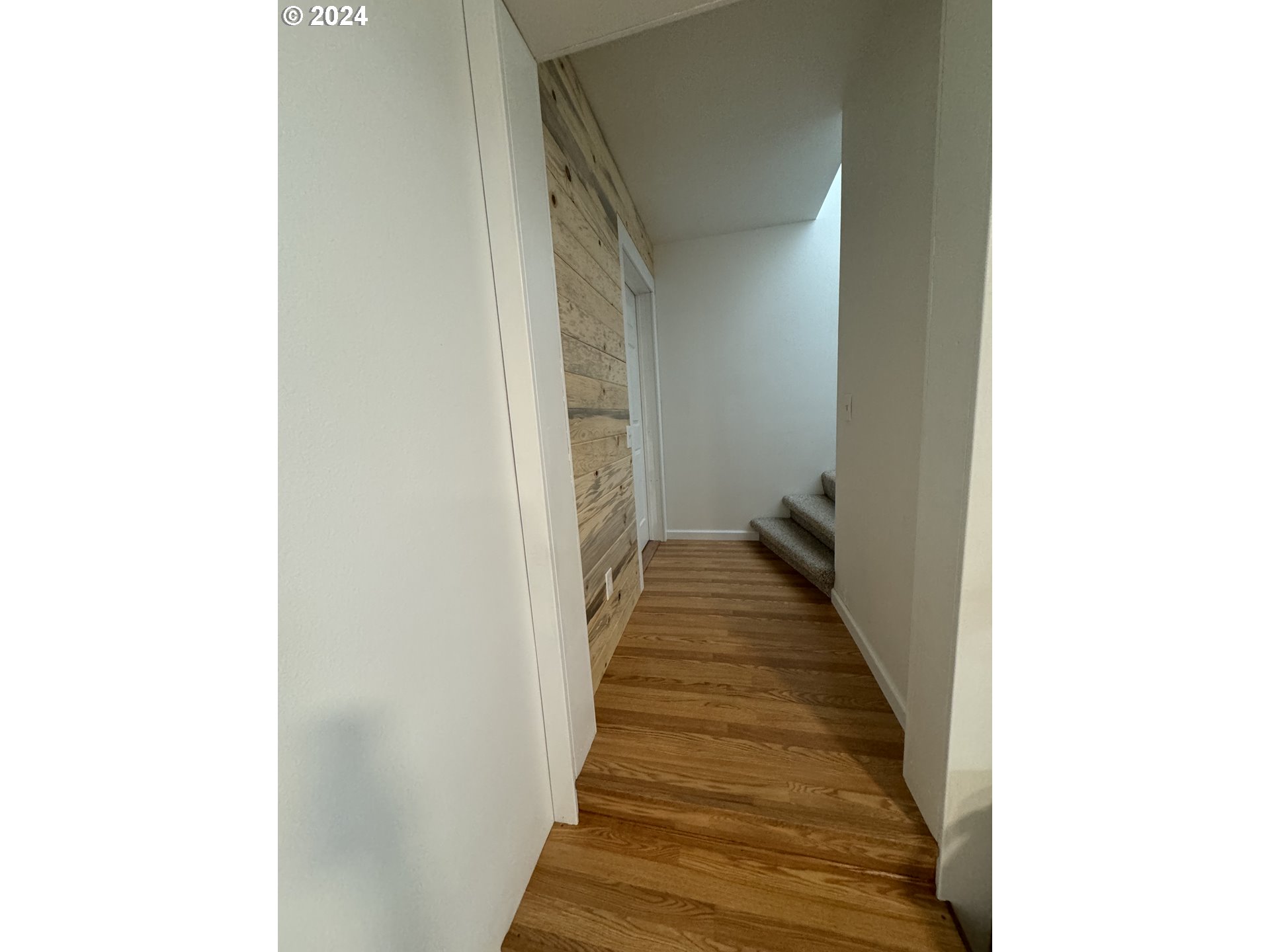 508 3rd Avenue Dallesport, WA 98617 - Photo 26 of 48 a view of a hallway with wooden floor