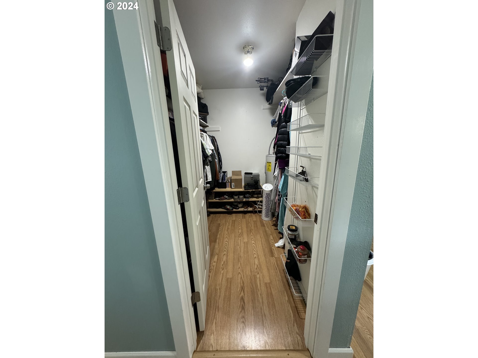508 3rd Avenue Dallesport, WA 98617 - Photo 3 of 48 a view of a hallway with wooden floor and stairs