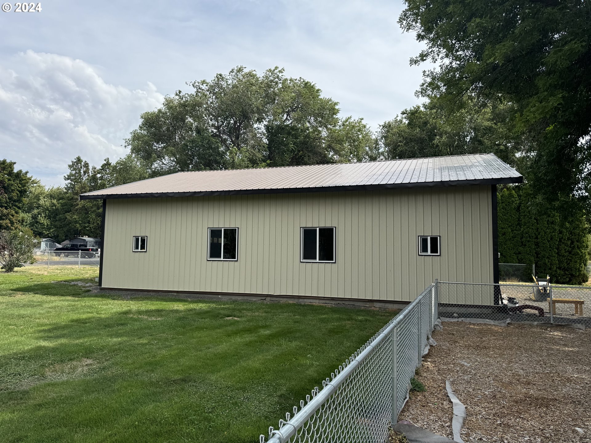 508 3rd Avenue Dallesport, WA 98617 - Photo 40 of 48 a backyard of a house with lots of green space
